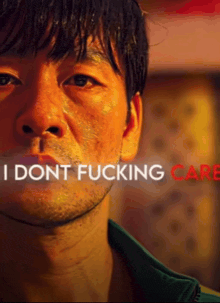 a close up of a man 's face with the words i dont fucking care