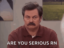 a man with a mustache is asking if he is serious