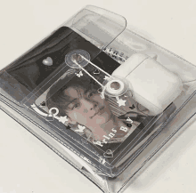 a clear plastic case with a picture of a boy and the words " pins by " written on it