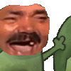 a man with a mustache is holding a green object in his mouth .