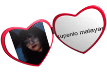 a heart shaped mirror with a picture of a woman and the words " kupenlo malayan " on it