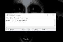 a screenshot of a notepad with a picture of a scary face .