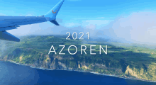 an airplane is flying over a landscape with the year 2021 azoren