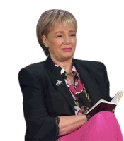 a woman wearing a black jacket and a pink floral shirt is reading a book