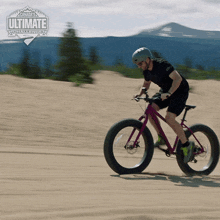 a man is riding a bicycle on a dirt road with the words canada 's ultimate challenge in the background