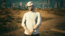 a man wearing glasses and a watch is standing on a dirt road