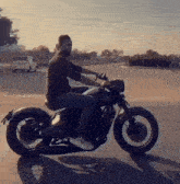 a man is riding a motorcycle with a license plate that says ' tc ' on it