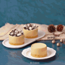 three desserts on a plate with the words mr.cakes on the bottom right