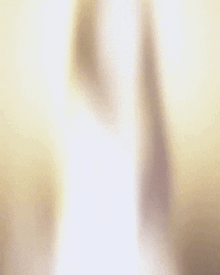 a woman with her arms outstretched is smiling and looking at the camera