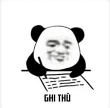 a panda bear is sitting at a table writing on a piece of paper with a pen .