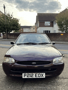 a ford car with a license plate that says p212eox