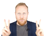 a man with glasses and a beard is making a peace sign with his hands .