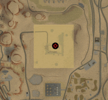 an aerial view of a desert landscape with a red circle in the middle