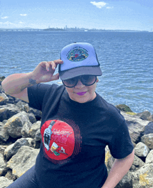 a woman wearing a shirt that says happy hour on it