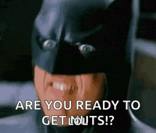 a man in a batman mask is asking if he is ready to get out .