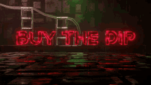 a neon sign that says buy the dip