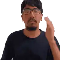 a man with glasses and a beard is giving a thumbs up