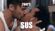 two men kissing with the words that 's sus on the bottom