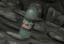 a bottle of dirty dew sits on a rocky ledge