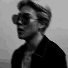 a blurry photo of a person wearing sunglasses