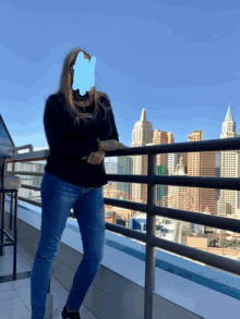 a woman is standing on a balcony with a blue circle around her face