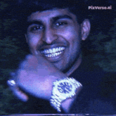 a man with braces on his teeth is wearing a wristwatch