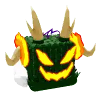 a green cube with horns and a glowing face on it