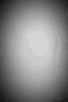a gray background with a white circle in the middle