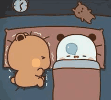 two bears are sleeping next to each other on a bed .