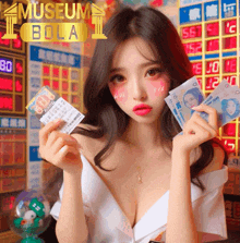 a woman is holding a ticket and money in front of a sign that says " museum bola "