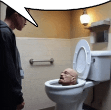 a man is standing next to a toilet with a man 's head sticking out of it