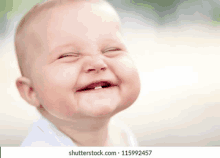 a baby with a missing tooth is making a funny face with his eyes closed .