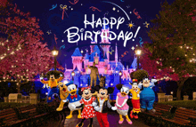 a group of mickey mouse characters standing in front of a castle with the words happy birthday written on the bottom