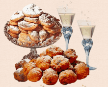 two glasses of champagne next to a plate of powdered sugar cookies