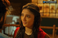 a woman looking at a man with the hashtag 7wickreddy