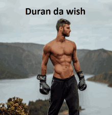 a shirtless man wearing boxing gloves stands in front of a body of water under the words duran da wish