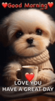 a puppy is sitting next to a cup of coffee with a red heart on it .