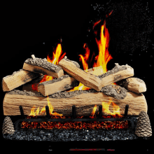 a pile of logs is burning in a fireplace against a black background