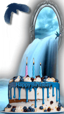 a birthday cake with blue frosting and candles with the words happy birthday on it