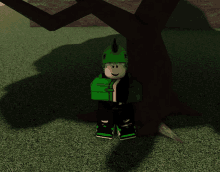 a cartoon character in a green dinosaur costume is sitting under a tree