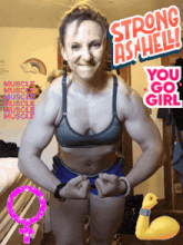a woman flexes her muscles in front of a sign that says strong as hell you go girl