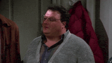 a man wearing glasses and a grey sweater says " sometimes "