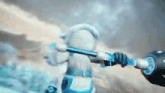 a cartoon character is holding a sword in a snowy area .