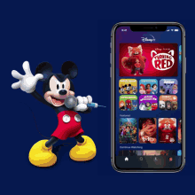 mickey mouse is singing into a microphone next to a disney app