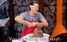 a man wearing goggles and an apron is making a teddy bear with the words you are yelling like crazy below him