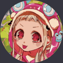 a girl wearing a pink hat with frogs on it