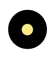 a black circle with a yellow dot in the center