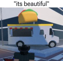 a white food truck with a taco on top and the words " its beautiful "