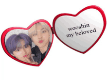 a heart shaped mirror that says " wooshin my beloved "