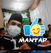 a man wearing a face mask is giving a thumbs up and the word mantas is on the bottom